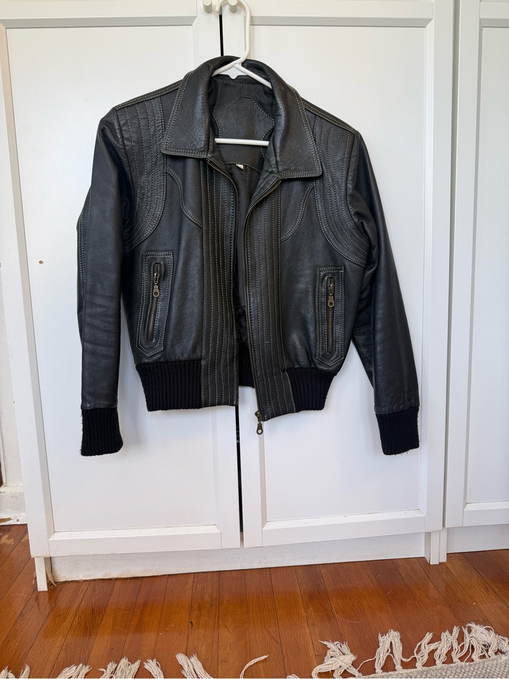 Vintage Black Leather Bomber Jacket with Ivory Stitching and Ribbed Trim